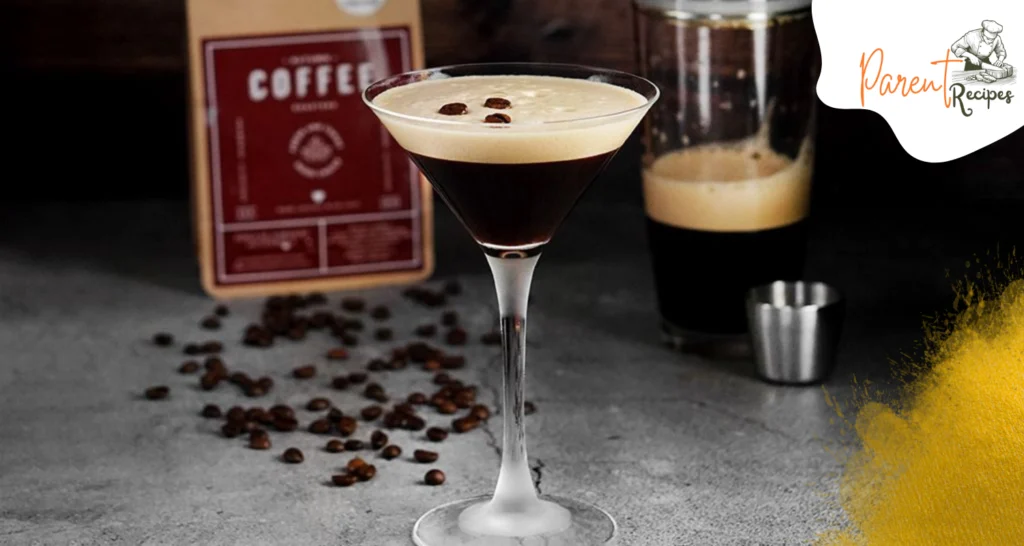 Bartender shaking an Espresso Martini cocktail in a metal shaker with ice cubes for a frothy finish