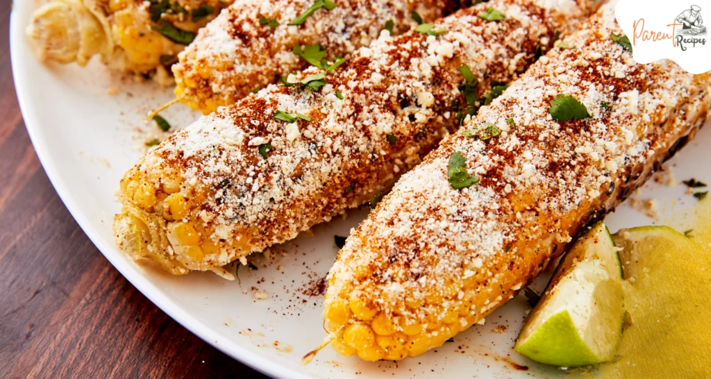 Street corn recipe with lime wedges and chili powder