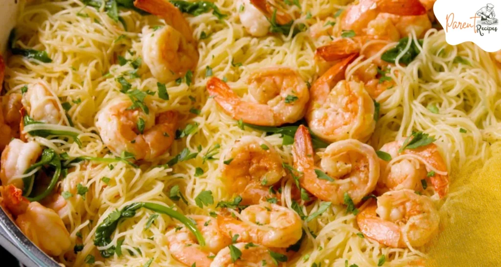 Creamy Cajun shrimp pasta topped with bell peppers and Cajun spices