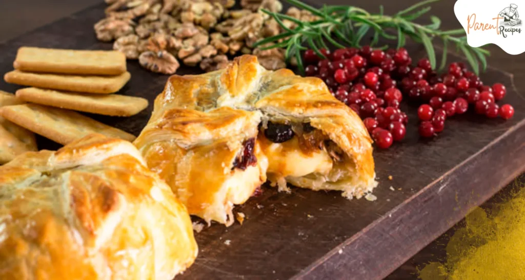 Close-up of creamy Baked Brie in Puff Pastry with jam filling